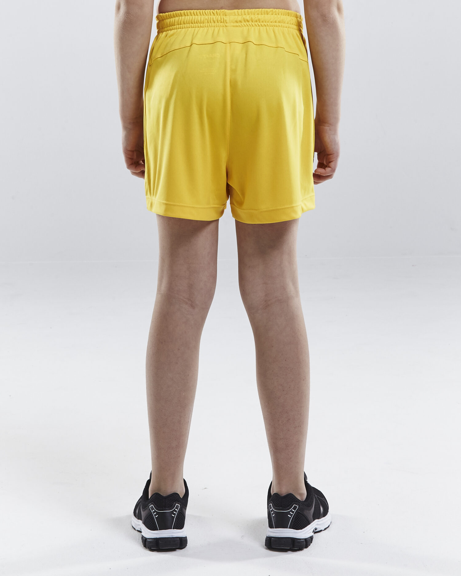 Craft Squad Go Short Solid Jr 1905586 Sweden Yellow